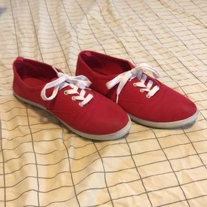 Red comfortable shoes and brown combat boots